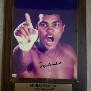 Authentically autographed framed photo of Muhammed Ali.